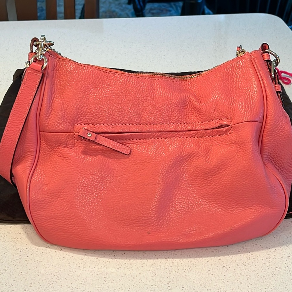 Kate spade coral pink hobo bag with two shoulder straps. Good condition.
